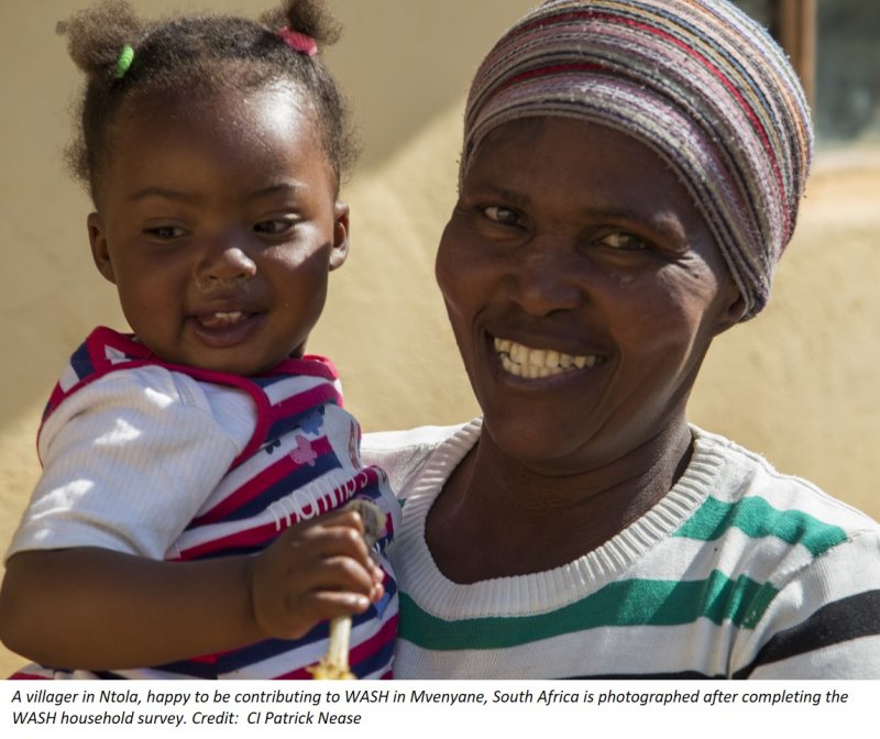 A villager in Ntola is photographed after completing the ABCG WASH household survey. Pcredit CI_Patrick Nease